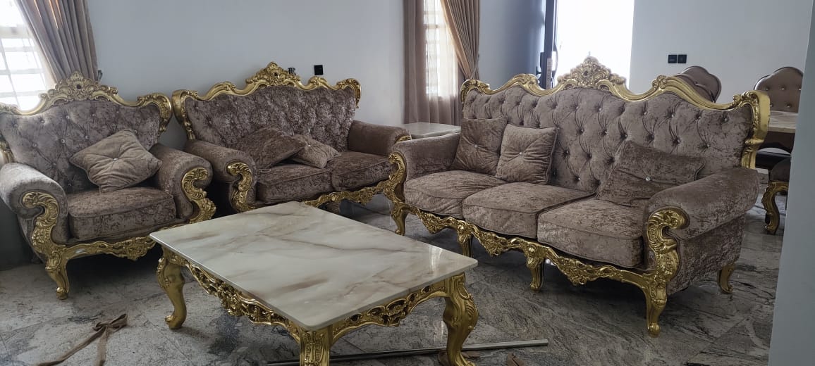 Gold-carved lounge suite with marble table